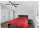 Bedroom featuring a ceiling fan, hardwood floors, two closets, and a nightstand at 1024 Cohassett Ave, Lake Wales, FL 33853