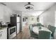 Inviting dining area seamlessly flows into the kitchen and living room, ideal for modern living and entertaining at 1024 Cohassett Ave, Lake Wales, FL 33853