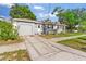 Charming single-story home with a classic driveway and well-maintained lawn at 1024 Cohassett Ave, Lake Wales, FL 33853