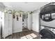 Well-organized laundry area with stackable washer/dryer, extra storage, and stylish accents at 1024 Cohassett Ave, Lake Wales, FL 33853