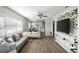 Open concept living room flowing into the kitchen with stylish furniture at 1024 Cohassett Ave, Lake Wales, FL 33853