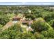 Property with ample space, surrounded by a canopy of trees at 1055 N Chickasaw Trl, Orlando, FL 32825