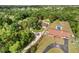 Expansive property featuring lush landscaping, mature trees, a pool, and two houses at 1055 N Chickasaw Trl, Orlando, FL 32825