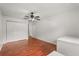 Bedroom with hardwood floors, closet featuring, and ceiling fan at 1055 N Chickasaw Trl, Orlando, FL 32825