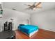Neutral bedroom with hardwood floors and ceiling fan at 1055 N Chickasaw Trl, Orlando, FL 32825