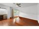 Bedroom with hardwood floors and a large window with natural light at 1055 N Chickasaw Trl, Orlando, FL 32825