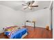 Bright bedroom featuring hardwood floors, and natural light from a window at 1055 N Chickasaw Trl, Orlando, FL 32825