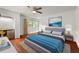 Bright bedroom with hardwood floors, ceiling fan, and a small kitchenette nook perfect for guests at 1055 N Chickasaw Trl, Orlando, FL 32825