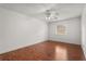 Bedroom featuring hardwood floors, ceiling fan, and natural light from a window at 1055 N Chickasaw Trl, Orlando, FL 32825