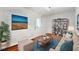 Comfortable living room area with modern furniture, a flat-screen TV, and hardwood floors at 1055 N Chickasaw Trl, Orlando, FL 32825