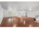 Large open living room with hardwood floors, neutral walls, and recessed lighting throughout at 1055 N Chickasaw Trl, Orlando, FL 32825