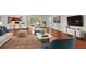 Staged living room showcasing hardwood floors, a modern design, and plenty of seating at 1055 N Chickasaw Trl, Orlando, FL 32825