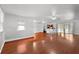 Bright living room featuring hardwood floors, white walls and ceiling fans at 1055 N Chickasaw Trl, Orlando, FL 32825