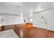 Bright and airy living room with beautiful hardwood floors and a decorative front door at 1055 N Chickasaw Trl, Orlando, FL 32825