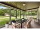 Spacious screened porch features an outdoor dining setup with comfortable seating at 1055 N Chickasaw Trl, Orlando, FL 32825