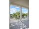 Balcony featuring stately columns, a white railing, and neighborhood views beyond mature trees at 1115 Mosaic Dr, Celebration, FL 34747