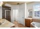 Bathroom with a dual sink vanity, a soaking tub, a separate shower, and tile flooring at 1115 Mosaic Dr, Celebration, FL 34747