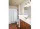 Bathroom featuring a double vanity, decorative lighting, and shower-tub combo with tile surround at 1115 Mosaic Dr, Celebration, FL 34747