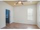 Bright bedroom with wood floors, large windows, and an en-suite bathroom at 1115 Mosaic Dr, Celebration, FL 34747