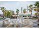 Stunning community landmark with palm trees and a decorative water fountain at 1115 Mosaic Dr, Celebration, FL 34747