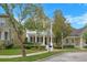 Charming two-story home with classic white columns and inviting curb appeal at 1115 Mosaic Dr, Celebration, FL 34747