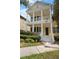Charming two-story home with a spacious porch and manicured landscaping offers curb appeal at 1115 Mosaic Dr, Celebration, FL 34747