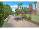 Enjoy outdoor games on the patio with lush greenery and a ping pong table at 1115 Mosaic Dr, Celebration, FL 34747
