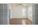 Light-filled home office with hardwood floors, large windows, and French doors at 1115 Mosaic Dr, Celebration, FL 34747