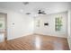 Spacious living room featuring wood floors, large windows, and a ceiling fan at 1115 Mosaic Dr, Celebration, FL 34747