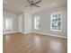 Open living space with wood floors, plenty of natural light, and neutral walls at 1115 Mosaic Dr, Celebration, FL 34747
