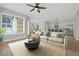 Spacious living room flowing into an open kitchen layout, perfect for entertaining at 1115 Mosaic Dr, Celebration, FL 34747