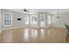 Well-lit living room featuring hardwood floors, and lots of natural light at 1115 Mosaic Dr, Celebration, FL 34747
