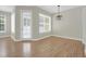 This living room boasts ample natural light and beautiful hardwood floors at 1115 Mosaic Dr, Celebration, FL 34747