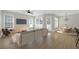 Well-decorated living room and dining area featuring hardwood floors at 1115 Mosaic Dr, Celebration, FL 34747