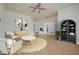 Stylishly furnished living room with wood floors, comfortable seating, and modern decor at 1115 Mosaic Dr, Celebration, FL 34747