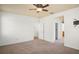 Spacious main bedroom with a ceiling fan and a view into the ensuite bathroom and walk in closet at 1115 Mosaic Dr, Celebration, FL 34747