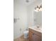 Cozy powder room with a vanity, toilet, and decorative towels at 1115 Mosaic Dr, Celebration, FL 34747