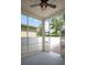 Screened porch with backyard views through white lattice framework and screened walls at 1115 Mosaic Dr, Celebration, FL 34747