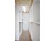 Walk-in closet with custom white shelving, drawers, and rods for organized storage at 1115 Mosaic Dr, Celebration, FL 34747