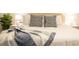 Bright bedroom features a padded headboard, plush pillows and a decorative throw blanket at 1160 Kingsbarn St, Davenport, FL 33896
