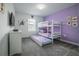 Fun bunkbed room with pull-out trundle and themed decor on the walls offers a playful space at 1160 Kingsbarn St, Davenport, FL 33896