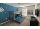 Charming bedroom featuring a bunk bed, Star Wars themed decor, and a bright blue accent wall at 1160 Kingsbarn St, Davenport, FL 33896