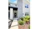 Inviting front entrance with modern design elements and well-maintained landscaping, creating a welcoming curb appeal at 1160 Kingsbarn St, Davenport, FL 33896
