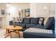 Cozy living room featuring a comfortable sectional sofa, stylish decor, and plenty of natural light at 1160 Kingsbarn St, Davenport, FL 33896