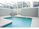 Private screened pool with ample patio space and two lounge chairs at 1160 Kingsbarn St, Davenport, FL 33896