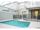 A screened in pool with safety fence and patio area for outdoor relaxation at 1160 Kingsbarn St, Davenport, FL 33896