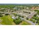 A lovely aerial view of a neighborhood with lush landscaping and community pool on a sunny day at 13758 Daniels Landing Cir, Winter Garden, FL 34787