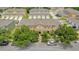 Aerial view of a home complex with parking and trees at 13758 Daniels Landing Cir, Winter Garden, FL 34787