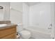 Clean bathroom features a bathtub and a wood vanity cabinet at 13758 Daniels Landing Cir, Winter Garden, FL 34787