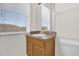 Cozy bathroom with wood cabinet and mirror above the sink at 13758 Daniels Landing Cir, Winter Garden, FL 34787